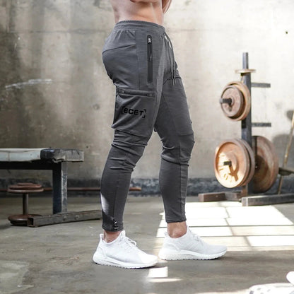 Pantalon de jogging sportif coupe ajustée homme | Avec poches zippées