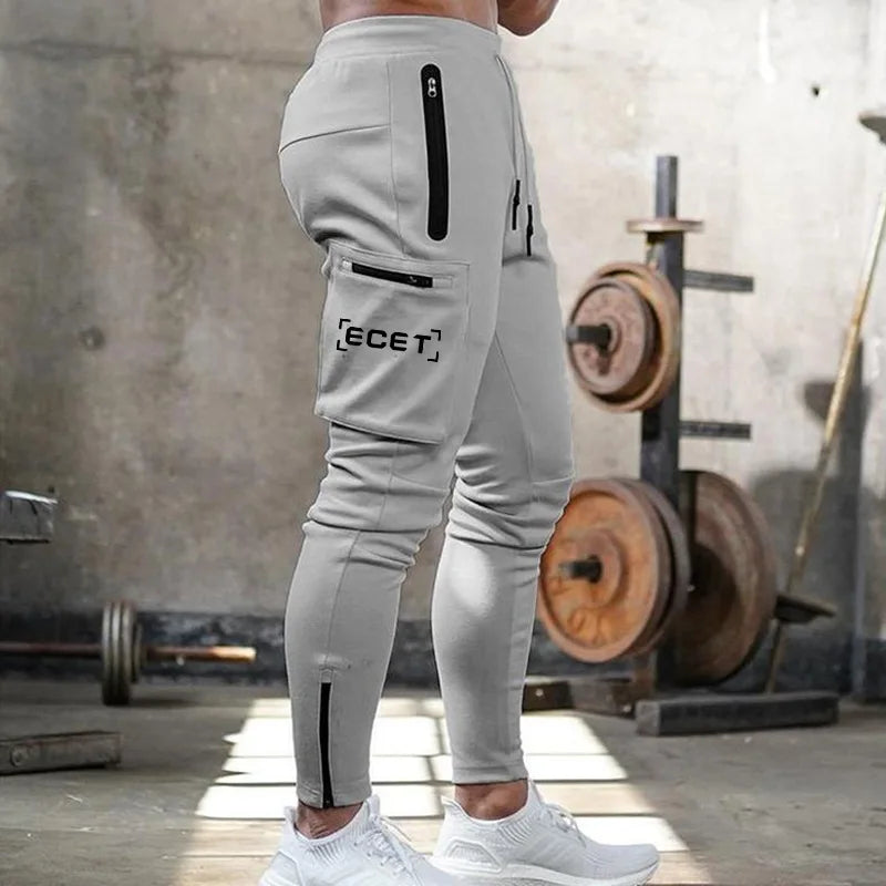 Pantalon de jogging sportif coupe ajustée homme | Avec poches zippées