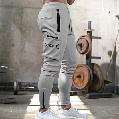 Pantalon de jogging sportif coupe ajustée homme | Avec poches zippées